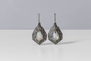 Todd Reed earrings with Fancy cut diamonds(~10ct), silver brilliant cut diamonds (~3.64ct), palladium, and sterling silver with patina.